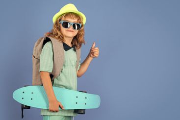 Childhood. Cute child with skateboard on color isoalted...