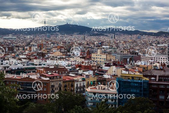 Barcelona city under cloudy sky overview