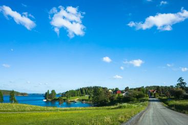 Swedish countryside landscape, Gravel road leading
