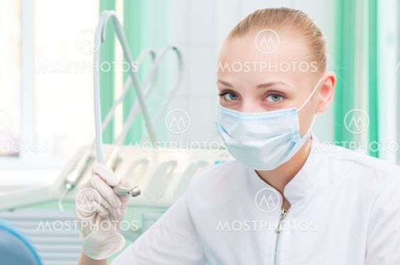 female dentists in protective mask