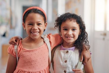 Hug, portrait and smile with friends in school together...