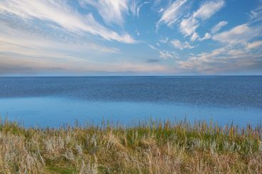 Sea, grass and beach in nature for travel, holiday and...