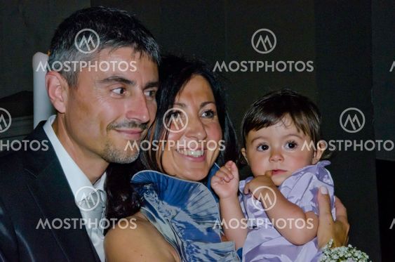 Groom, Bride and Daughter at the Wedding