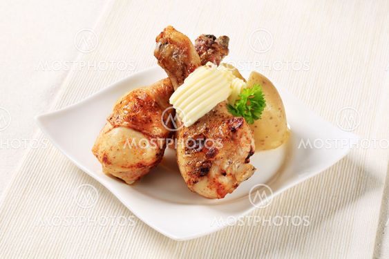 Roast chicken drumsticks and new potatoes
