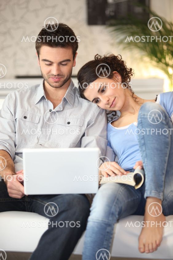 Couple sitting on sofa