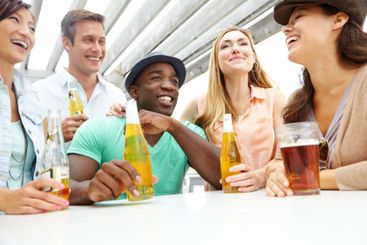 Beer, diversity and group of friends at pub together for...