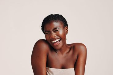 Beauty, smile and laugh with black woman in studio for...