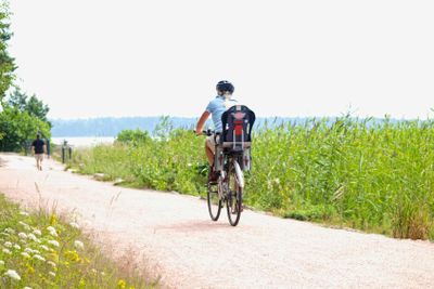 Biker on little gravel road