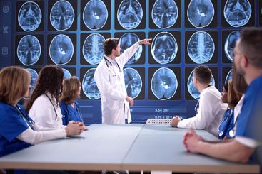 Medical Team Analyzing MRI Scan For Neurology Diagnosis
