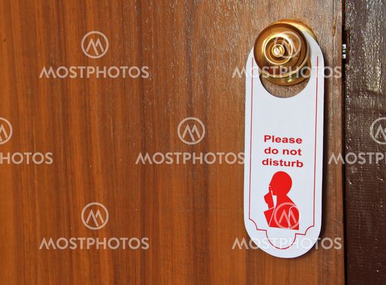 Please do not disturb hotel tag hanging on door knob