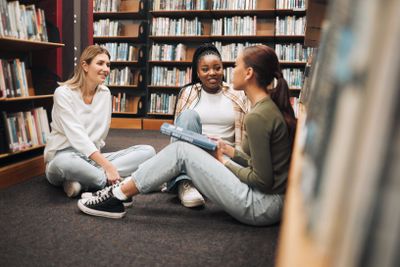 Library, book and group of women reading for education,...