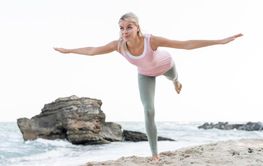 blonde woman doing yoga beach 5