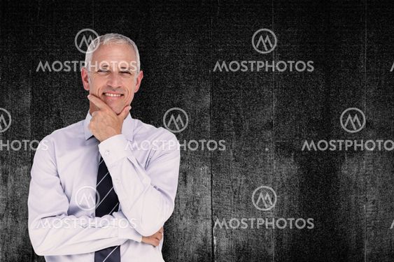 Composite image of businessman thinking