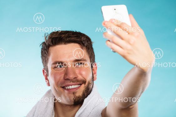 Happy half shaved man taking selfie self photo.