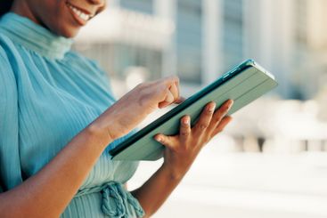 Business, tablet and woman in city, hands and connection...