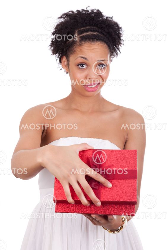 Disappointed young African American woman opening a gift box