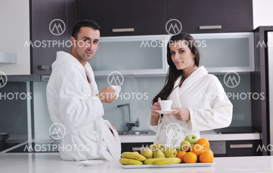 young couple have fun in modern kitchen