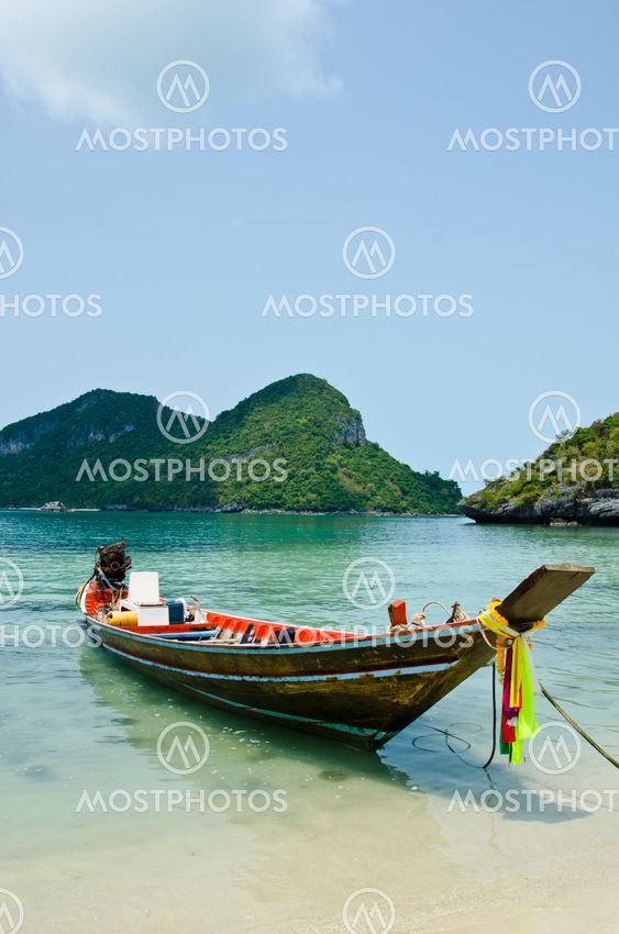 long tail boat on the beach