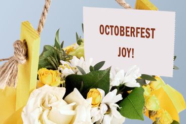 OCTOBERFEST JOY concept words on a white card in a...