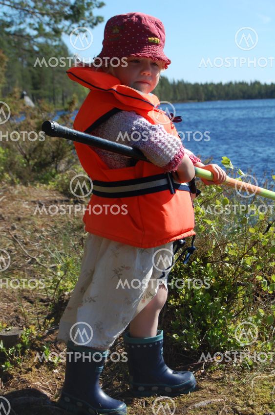Girl with a life jacket fishing