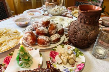 Festive table setting with traditional treats and...