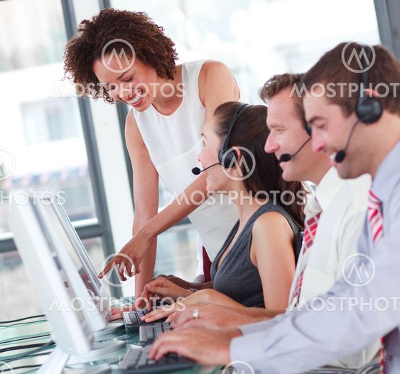 Beautiful female manager with her sale representative team