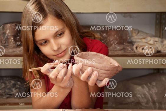 Girl working with clay
