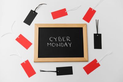 chalk board with cyber monday words and sale tags