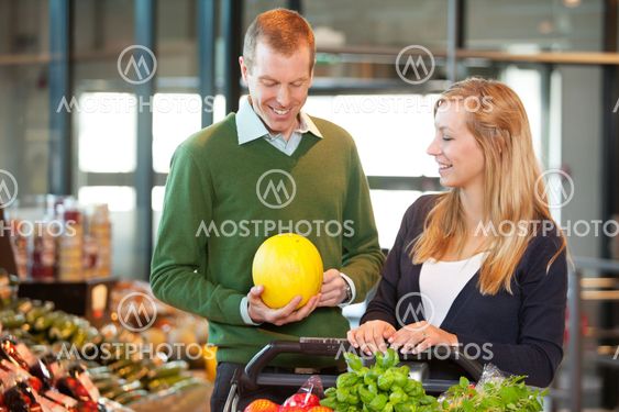 Man and Woman Buying Fruit