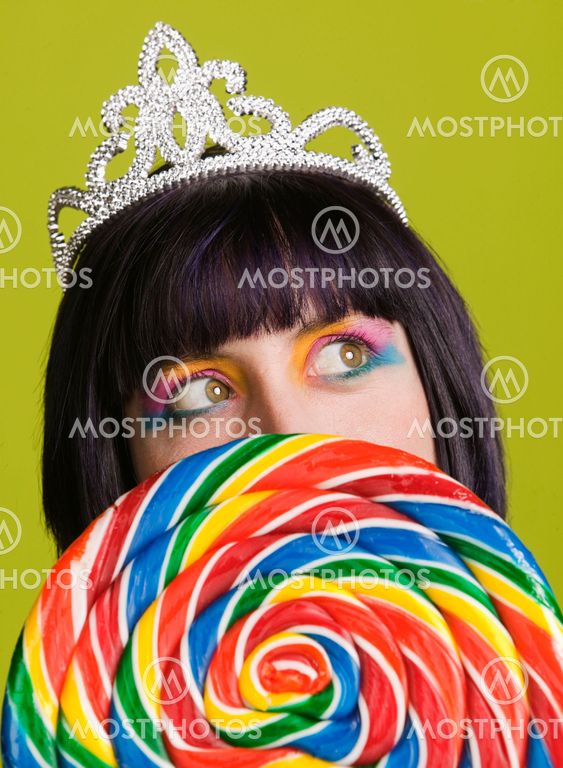 Young punk woman with a big lollipop