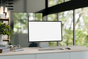 A computer desk in a modern office or home office...