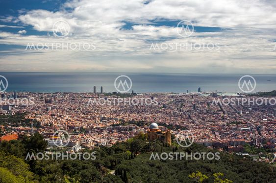 Barcelona city under cloudy sky overview