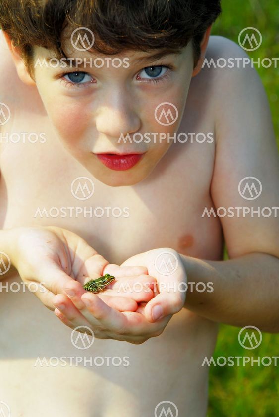 Boy holding a frog