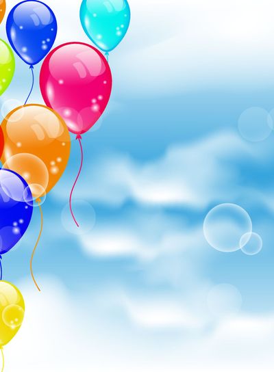 Flying colourful balloons in blue sky