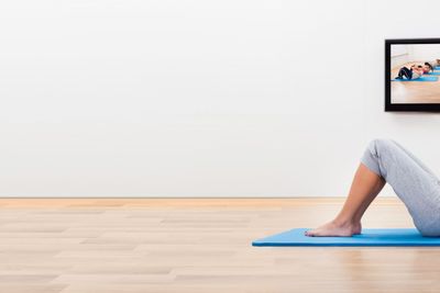 Athletic woman working out at home