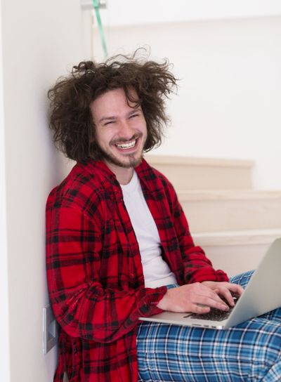 freelancer in bathrobe working from home