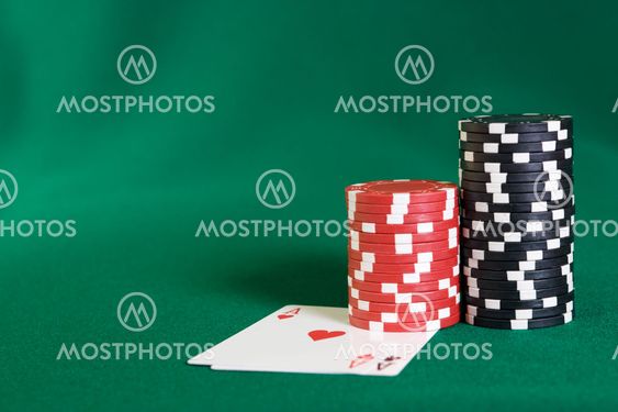 Stack of chips and two aces