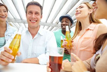 Beer, bonding and group of friends at pub together for...