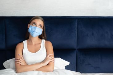 Depressed Girl Sitting In Bed Bored From Quarantine...