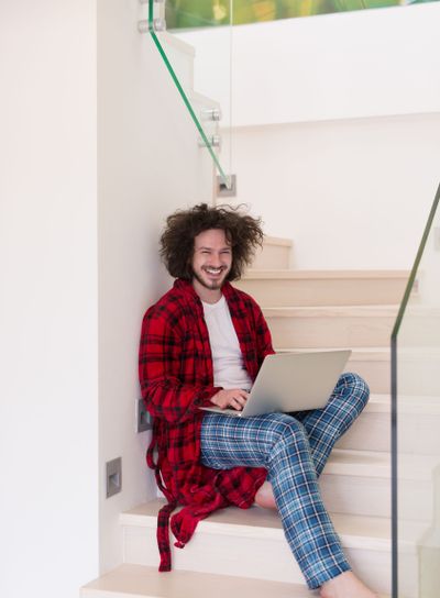freelancer in bathrobe working from home