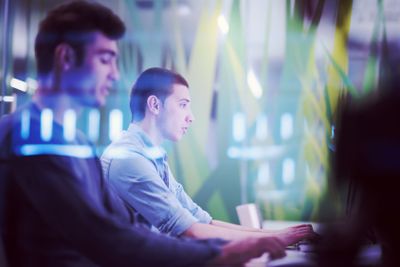 technology students group working  in computer lab school...