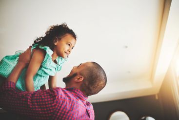 Carrying, dad and child in home, fun and bonding in...