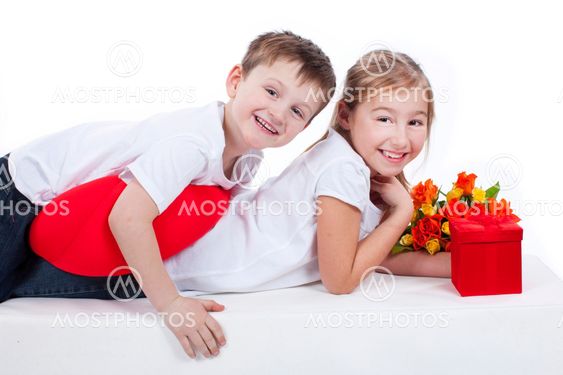 Boy and girl with flowers and gift
