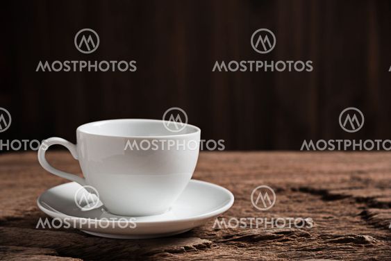 white coffee cup on wooden table