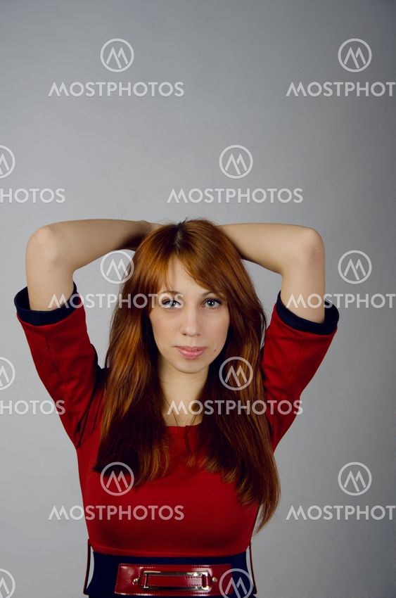 Beautiful young girl in a red dress