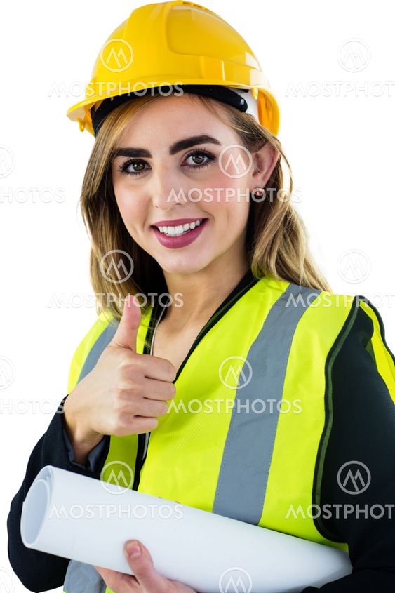 Smiling woman holding construction plan