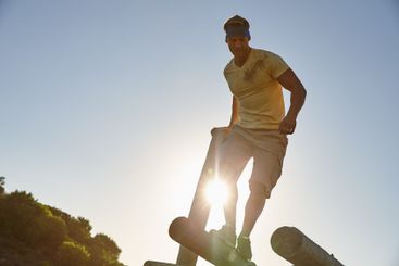 Athlete man, jumping and course of obstacle for physical...