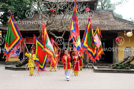 Group of people in traditional costume give gifts to the...