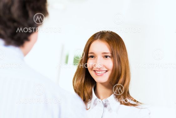 Attractive woman talking with a man