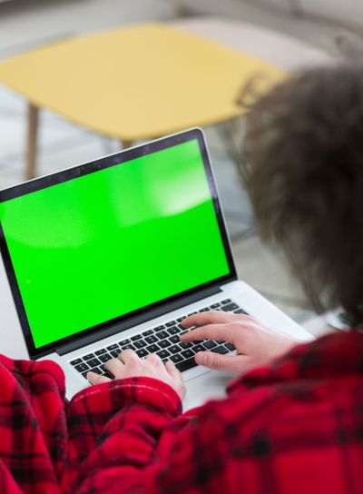 man freelancer in bathrobe working from home